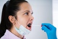 Doctor Taking Mouth Fluid Swab Sample Royalty Free Stock Photo