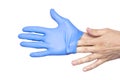 Doctor taking off her blue medical gloves. White background Royalty Free Stock Photo