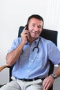 Doctor talking on mobile phone Royalty Free Stock Photo