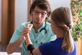 Orthopedist examining elbow Royalty Free Stock Photo