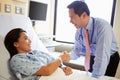 Doctor Talking To Female Patient On Ward Royalty Free Stock Photo