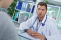 Doctor talking to patient during visit Royalty Free Stock Photo