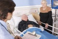 Doctor talking to senior couple in hospital Royalty Free Stock Photo