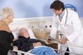 Doctor talking to senior couple in hospital Royalty Free Stock Photo