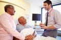 Doctor Talking To Senior Couple On Ward Royalty Free Stock Photo