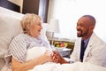 Doctor Talking To Senior Female Patient In Hospital Bed Royalty Free Stock Photo