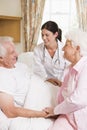 Doctor Talking To Senior Man And His Wife Royalty Free Stock Photo