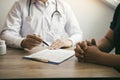 Doctor talking to a senior patient in a clinic