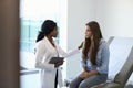 Doctor Talking To Unhappy Teenage Patient In Exam Room Royalty Free Stock Photo