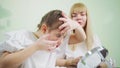 a doctor teaches girl to put on orthokeratological contact lenses