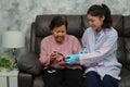 doctor teaching senior woman to using glucometer checking blood sugar level. diabetes concept Royalty Free Stock Photo