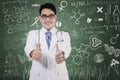 Doctor with thumbs up and scribble Royalty Free Stock Photo