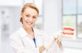 Doctor with toothbrush and jaws Royalty Free Stock Photo