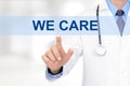 Doctor touching WE CARE sign on virtual screen Royalty Free Stock Photo