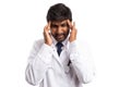 Doctor touching forehead as headache gesture