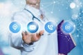 A doctor is touching the icons with communication and interaction symbols inside .