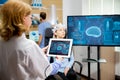 Doctor tracking the evolution of the patient`s brain on the tablet