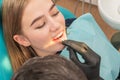 Doctor treats a patient tooth