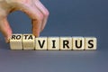 Doctor turns cubes and changes the word 'virus' to 'rotavirus'. Beautiful grey background. Medical 