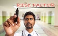 Doctor underlining close-up of risk factors Royalty Free Stock Photo