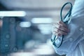 Doctor in uniform on blurred hospital background Royalty Free Stock Photo