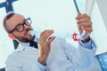 Doctor in uniform working at testing laboratory at clinic, clinical laboratory