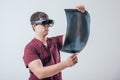 Doctor uses augmented reality goggles to exam x-rays film