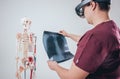 Doctor uses augmented reality goggles to exam x-rays film