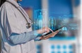 Doctor using clipboard and digital tablet find information patient medical history at the hospital. Medical technology concept Royalty Free Stock Photo