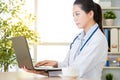 Doctor using computer to research internet, healthcare and medic Royalty Free Stock Photo