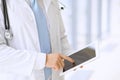 Doctor using a digital tablet, close-up of hands. Health care concept Royalty Free Stock Photo