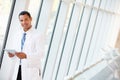 Doctor Using Digital Tablet In Corridor Of Modern Hospital Royalty Free Stock Photo