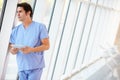 Doctor Using Digital Tablet In Corridor Of Modern Hospital Royalty Free Stock Photo