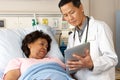 Doctor Using Digital Tablet Talking With Senior Patient Royalty Free Stock Photo