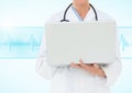 Doctor using laptop against blue background with heart rate Royalty Free Stock Photo