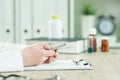 Doctor using smartphone in medical office Royalty Free Stock Photo
