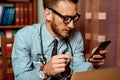 Doctor using smartphone Royalty Free Stock Photo