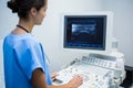 Doctor using sonography machine Royalty Free Stock Photo