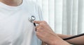 Doctor using sphygmomanometer with Stethoscope to check the heart rate of patients in the examination room at the hospital Royalty Free Stock Photo