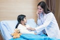 Doctor using stethoscope for examining a little kid