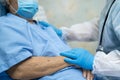 Doctor using stethoscope to checking Asian senior or elderly old lady woman patient wearing a face mask in hospital for protect Royalty Free Stock Photo