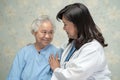 Doctor using stethoscope to checking the patient sit down on a bed in the hospital ward, healthy strong medical concept Royalty Free Stock Photo