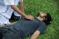 Doctor using stethoscope to listen heart beat of a man, who hear