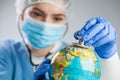 Doctor using a stethoscope to listen to the planet Earth globe and set diagnosis Royalty Free Stock Photo