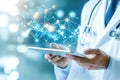 Doctor using tablet with digital network connections in modern medical technology concept Royalty Free Stock Photo