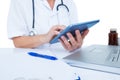 Doctor using a tablet in the office Royalty Free Stock Photo