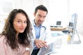 Doctor using tablet to inform patient