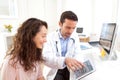 Doctor using tablet to inform patient Royalty Free Stock Photo