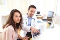 Doctor using tablet to inform patient Royalty Free Stock Photo