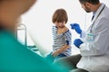 Doctor vaccinating child patient in hospital